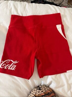 Kith Red Bike Shorts with White Coca Cola Logo